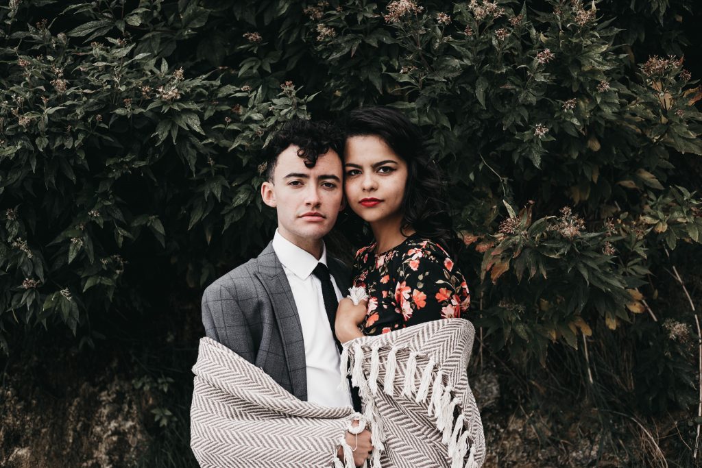 Jodi + Jade Howth engagement shoot wrapped up in a blanket