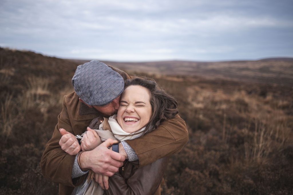 Marli + Andre wicklow mountains engagement shoot couple him kissing her neck