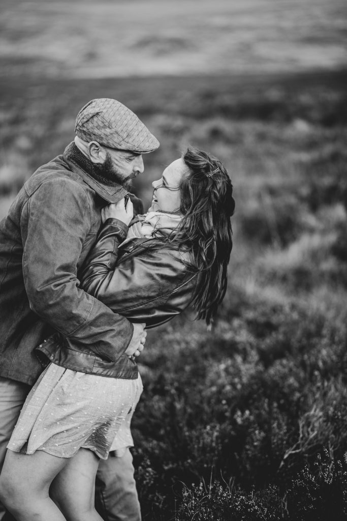 Marli + Andre wicklow mountains engagement shoot couple him dipping her