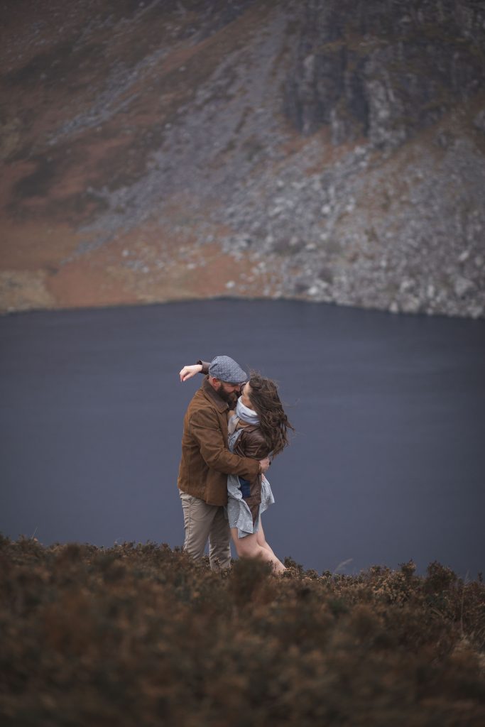 Marli + Andre wicklow mountains engagement shoot dramatic kiss in the mountains
