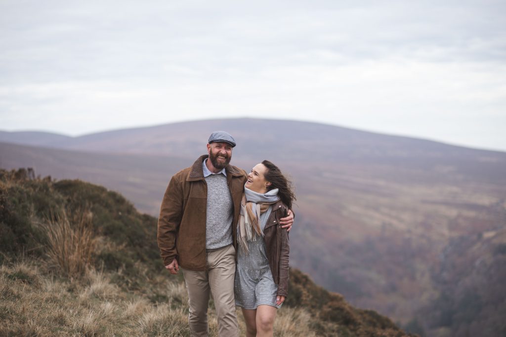 Marli + Andre wicklow mountains engagement shoot couple holding each other and laughing