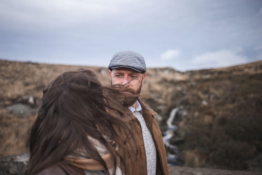 Marli + Andre wicklow mountains engagement shoot couple him looking at her