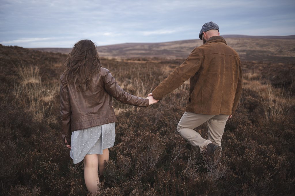 Marli + Andre wicklow mountains engagement shoot couple walking off into the mountains