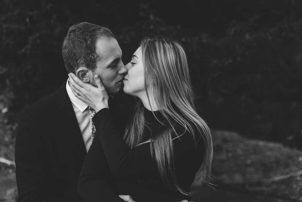 Luke and Kate engagement shoot couple kissing in black and white at the wroxton Abbey in Banbury