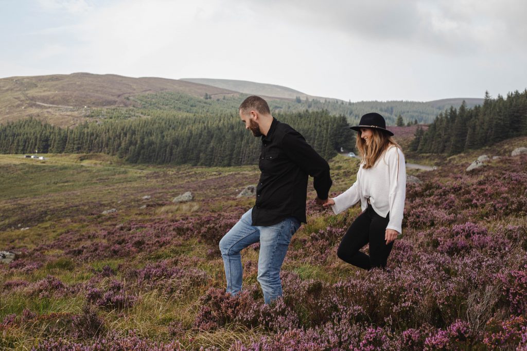 Anna and Colm couples photography in wicklow mountains walking in heather