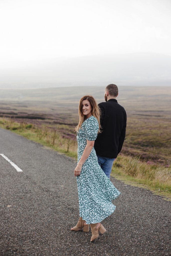 Anna and Colm couples photography in wicklow mountains woman looking back at the camera