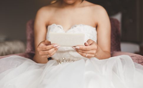 Jodi and Jade wedding photography Dublin Wexford bride reading her letter from husband in wedding dress