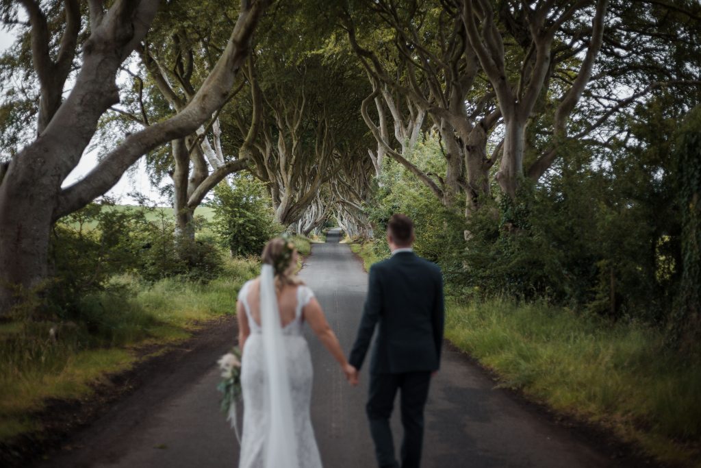 Jack and Katie Dark hedges Elopement wedding photography walking down the dark hedges